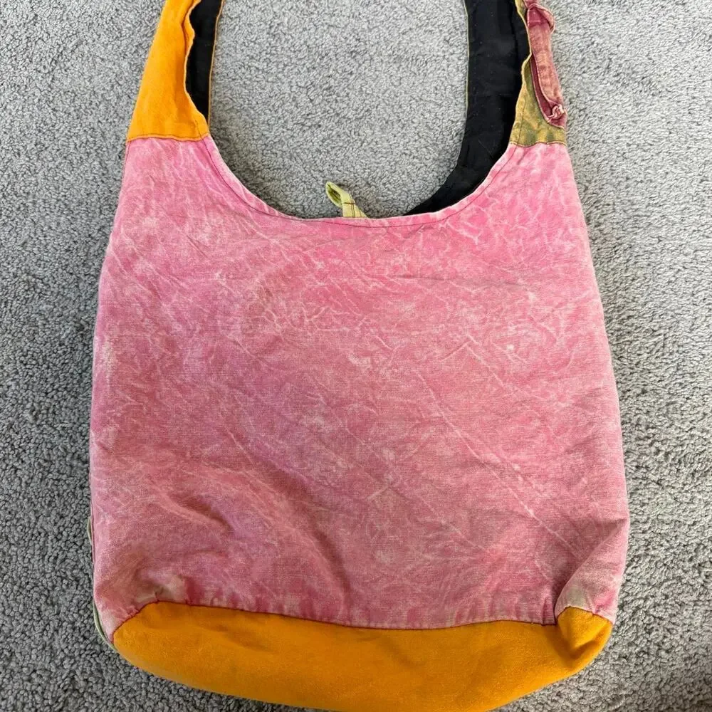 Patchwork hippie style bag with peace sign, star, and floral appliqués